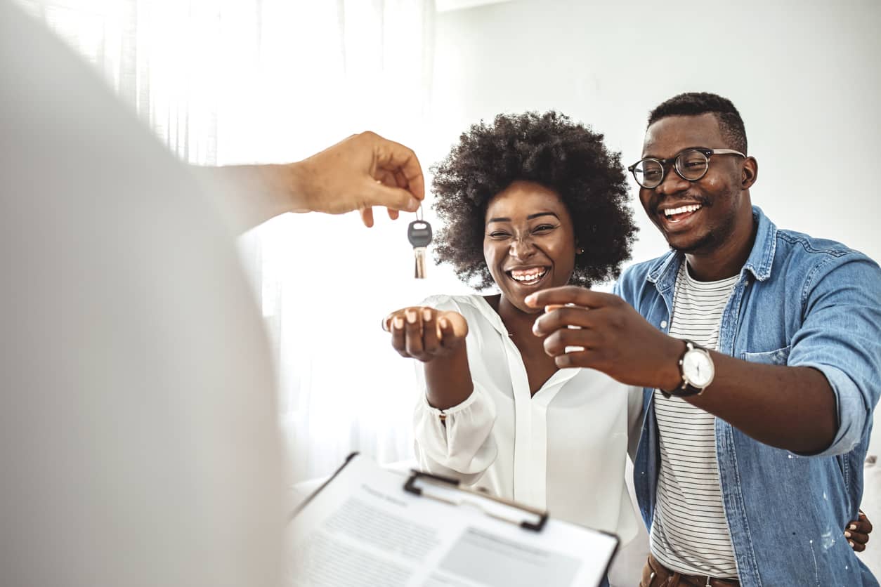 A couple receiving house keys